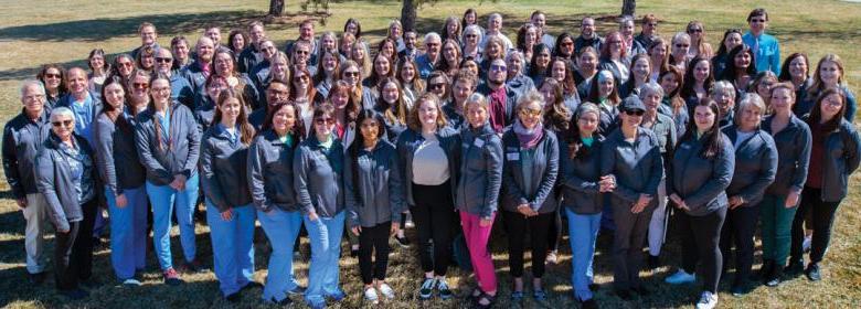 photo of approximately 90 Health District staff members gathered at Old Fort Collins Heritage Park. Photo by Emma Holt.